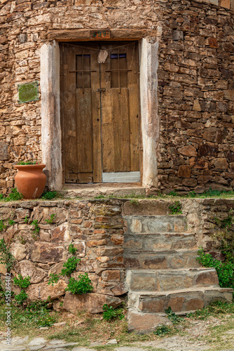 Old wood door in a stone house.