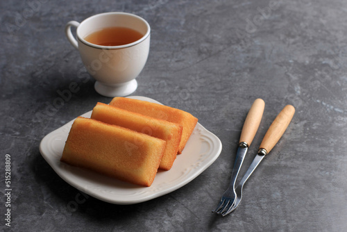 Homemade Financier Cake with Tea, Copy Space for Text. FInancier is French Cake with Butter photo