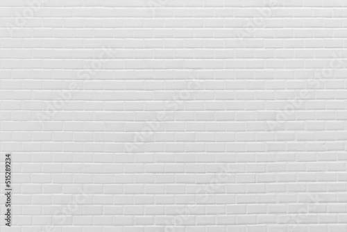 Abstract weathered texture white brick wall background in rural room. White brickwork architecture wallpaper