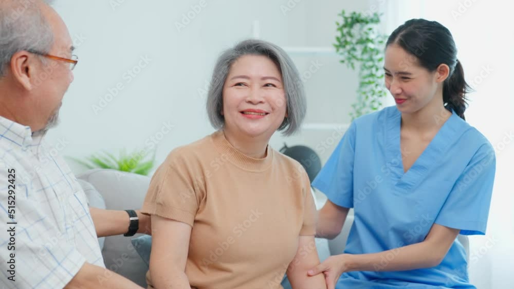 Asian senior woman doing physical therapy with caregiver and husband. Asian senior woman doing physical therapy with caregiver and husband.