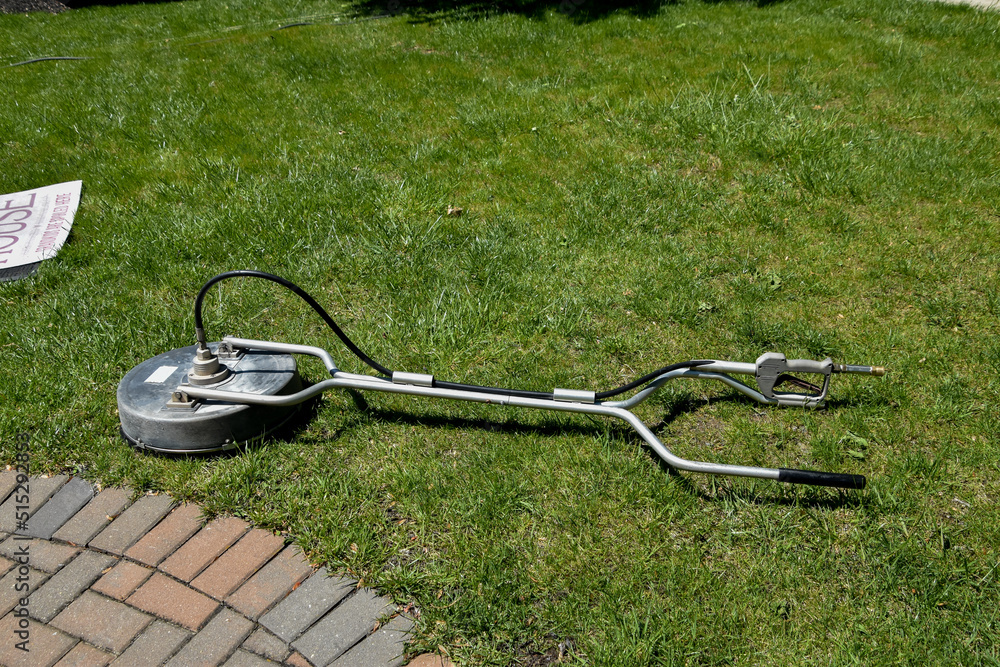 Circular high pressure power washer used on sidewalks and driveways