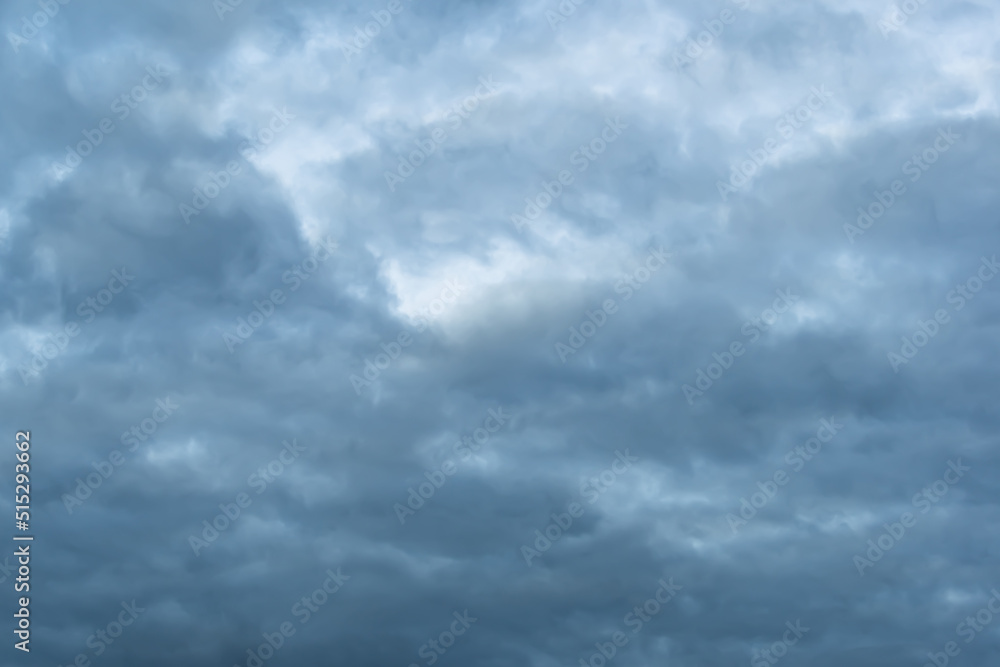 Structure of overcast sky as background. Clouds form texture. Approaching rain front, weather change