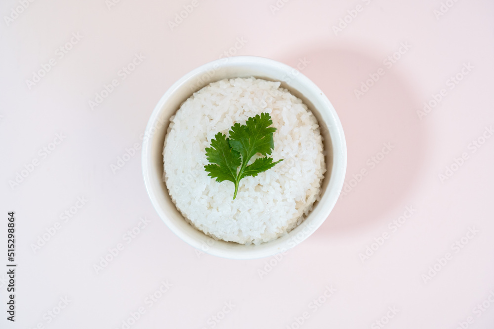 A studio shot of a bowl of rice on a plain background. A studio shot of a bowl of rice on a plain background.
