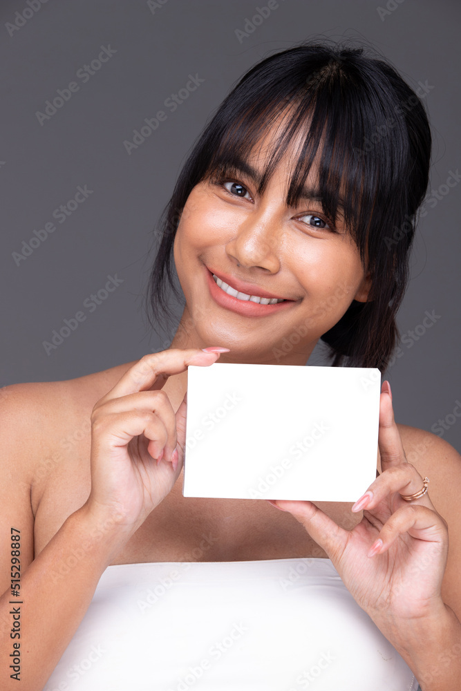 Asian Indian woman show beautiful smile happy lips, hold empty blank package box for treatment skin Asian Indian woman show beautiful smile happy lips, hold empty blank package box for treatment skin