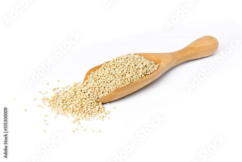 Quinoa seeds (Chenopodium) in wooden spoon isolated on white background. 