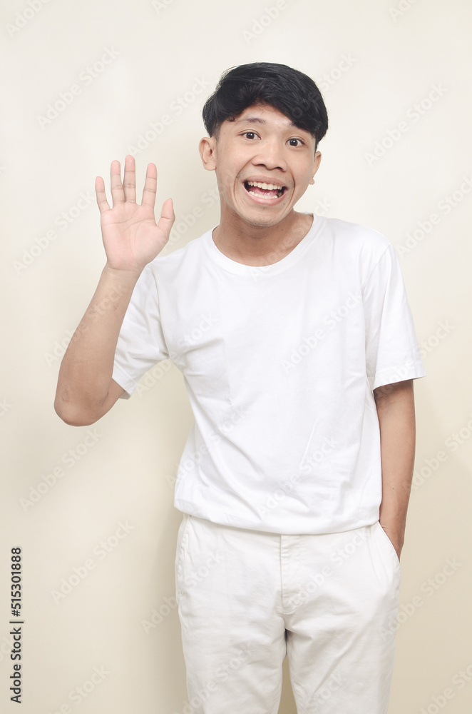 handsome and friendly young asian man smiling, casually dressed with happy and confident expression handsome and friendly young asian man smiling, casually dressed with happy and confident expression