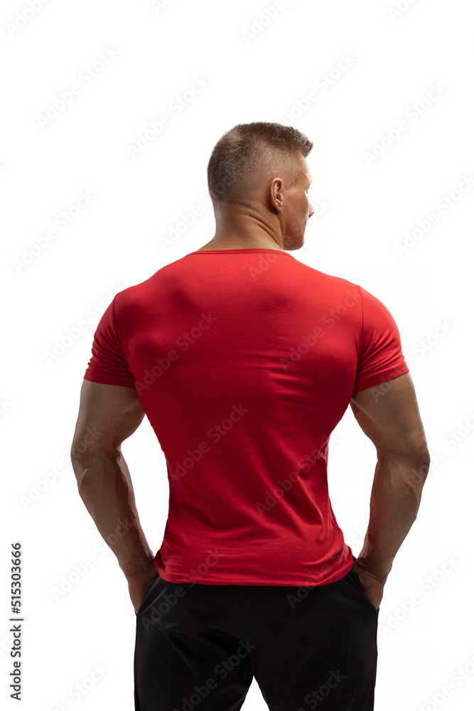Handsome athletic man posing in a T-shirt on a white background Handsome athletic man posing in a T-shirt on a white background