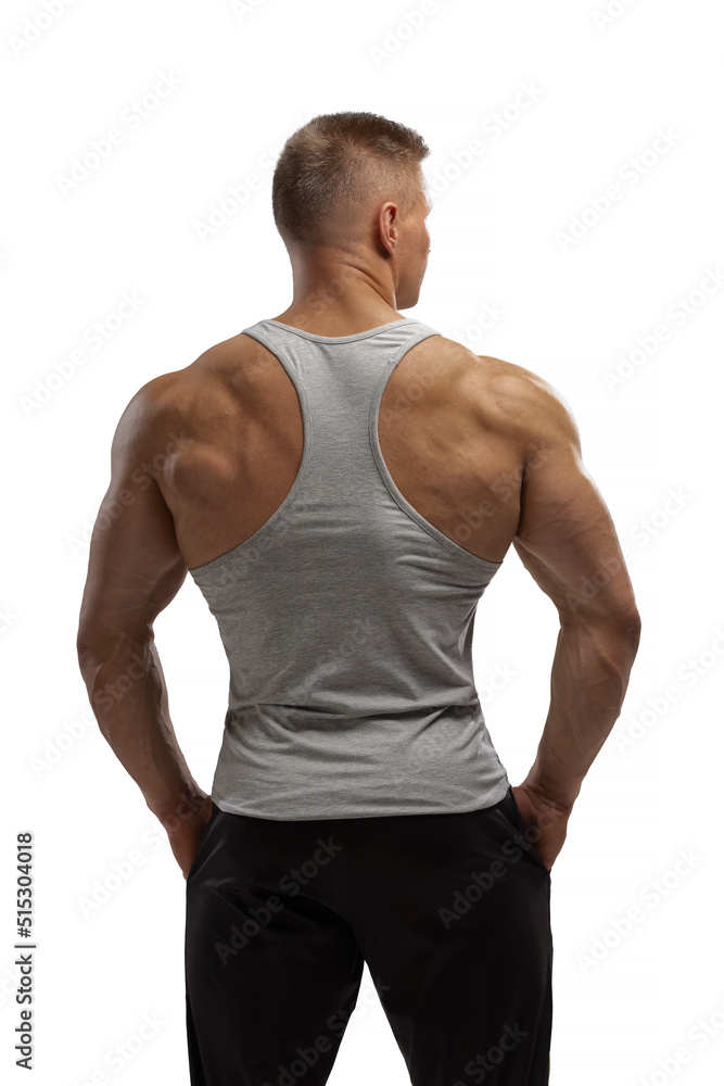 Hight-level bodybuilder posing in tank-top in white background Hight-level bodybuilder posing in tank-top in white background