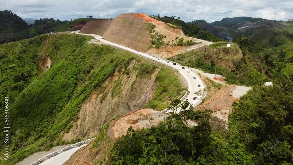 Aerial shot of cars on a mountain road Aerial shot of cars on a mountain road