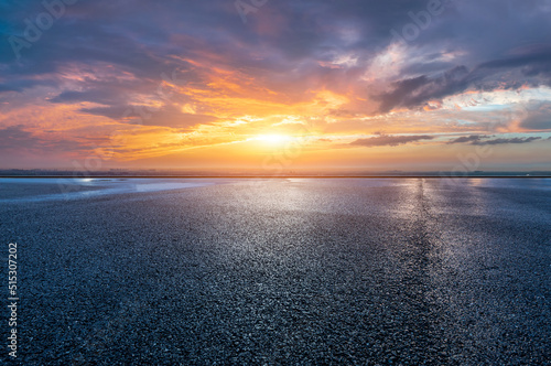 Asphalt road platform and sky sunset clouds background