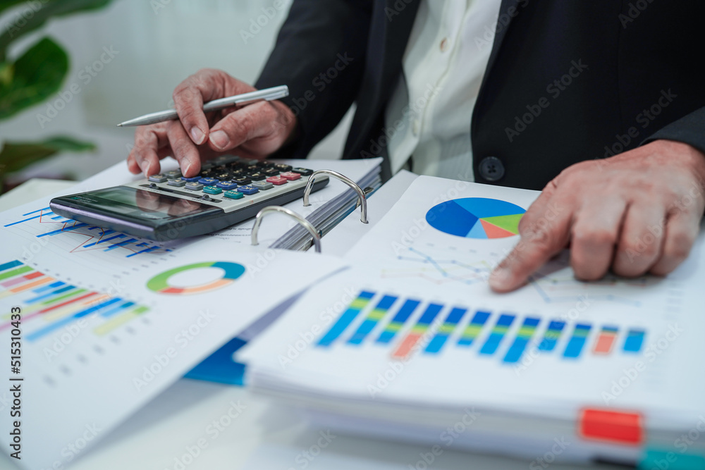 Fototapeta premium Businessman working and analysis with statistic graph in office.