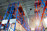 Interior of Storage Warehouse. Racks Pallets Shelves. Metal Construction. Row of Tall Shelf in Distribution Storehouse.	
