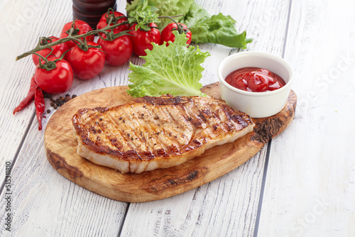 Grilled pork steak with ketchup