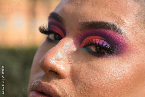 Detail of eyes of non-binary, young, South American person, heavily make up, close up. Concept queen, lgbtq+, pride, queer, eye shadow.