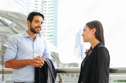 young attractive businessman chatting to colleague outside office in the urban © Verin