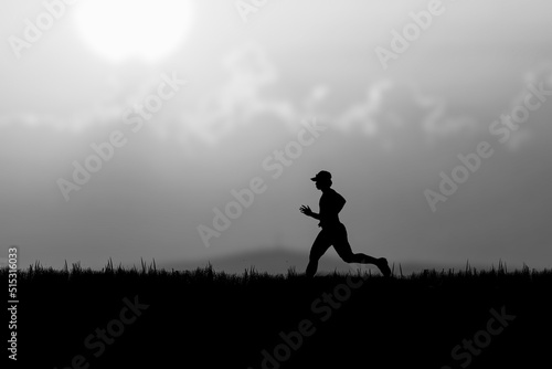 Silhouette of a runner practicing in the evening. Training ideas after the coronavirus crisis