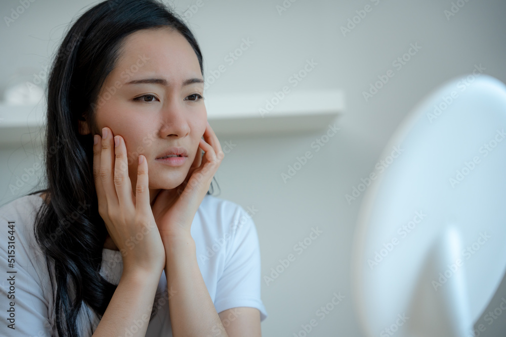 Young woman asian are worried about faces Dermatology and allergic to steroids in cosmetics. sensitive skin,red face from sunburn, acne,allergic to chemicals,rash on face. skin problems and beauty Young woman asian are worried about faces Dermatology and allergic to steroids in cosmetics. sensitive skin,red face from sunburn, acne,allergic to chemicals,rash on face. skin problems and beauty