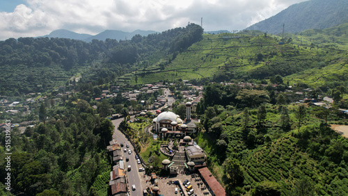 Aerial view of The Largest Mosque At Taawun Puncak, Ramadan Eid Concept background, Travel and tourism. Bogor, Indonesia, July 6, 2022 photo