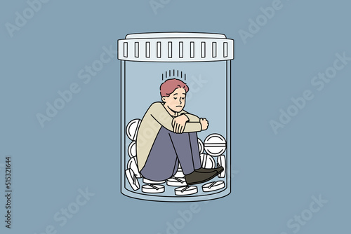 Unhappy man sitting in bottle with medicines suffer from depression or nervous breakdown. Upset stressed male struggle with drug and medication addiction. Vector illustration. 