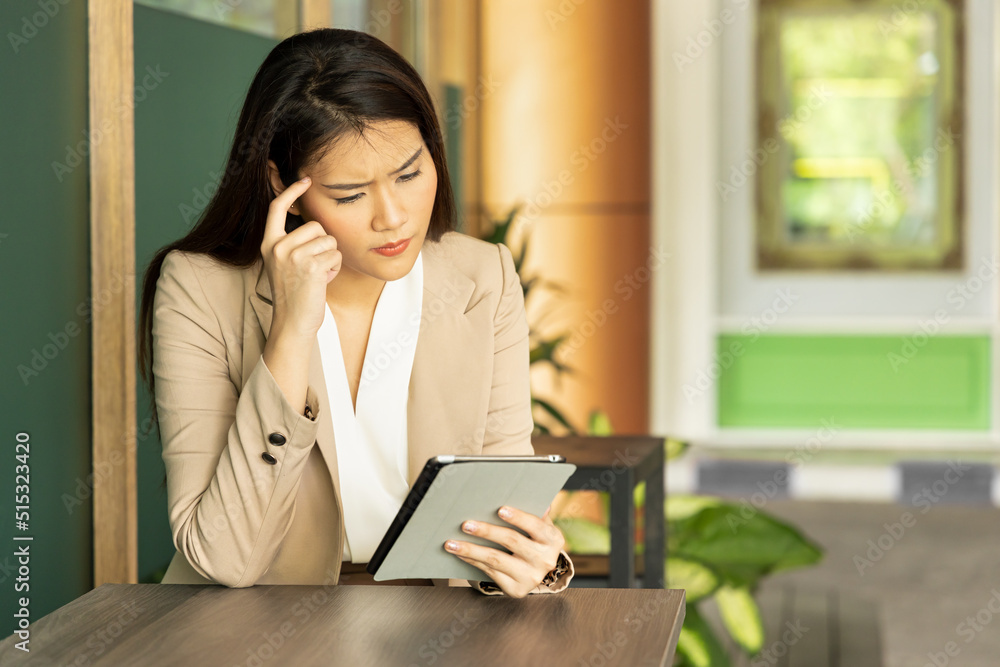 Asian business woman or office worker working with hard job and problem Asian business woman or office worker working with hard job and problem