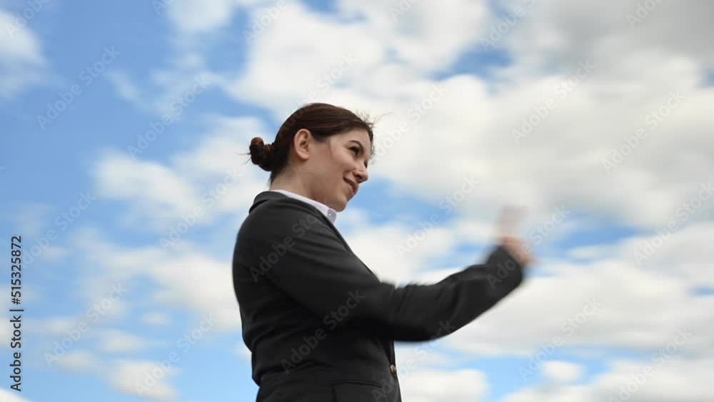 Business woman stretches out her hand and points her finger outdoors. Video 360 degrees. Business woman stretches out her hand and points her finger outdoors. Video 360 degrees.