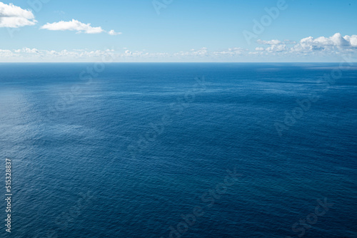 Fotobehang Clear and minimalistic panoramic seascape showing the endless blue waters of the