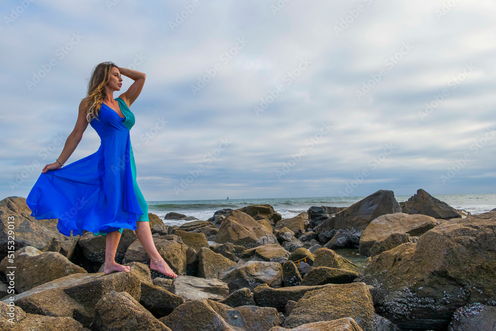 Lovely Brunette Latin Model Poses Outdoors On A Beach At Sunset