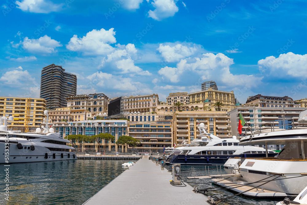 Fototapeta premium France, French Riviera, Monte Carlo marina with luxury yachts and cars in Monaco bay.