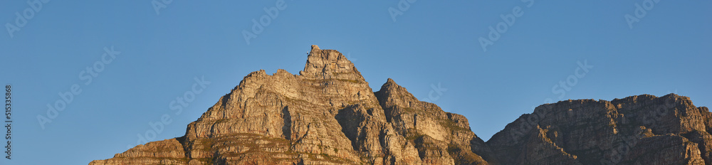 Copy space with scenic landscape view of Table Mountain in Cape Town, South Africa against a clear blue sky background. Majestic panoramic view of an iconic landmark and famous travel destination