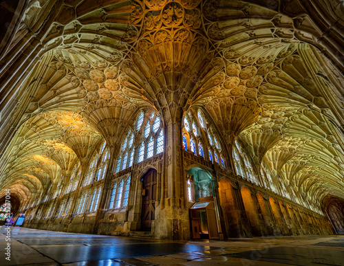 The very elegant Cloisters in Gloucester Cathedral showing its arches and also its very intricate and unique architecture.