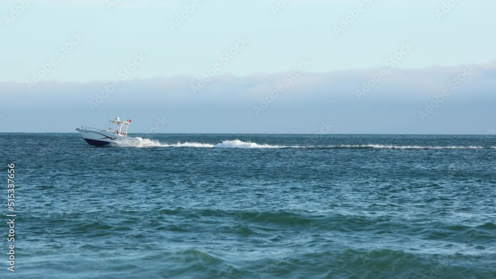Aerial drone video of motor speed boat cruising open ocean deep blue sea. Aerial drone video of motor speed boat cruising open ocean deep blue sea.
