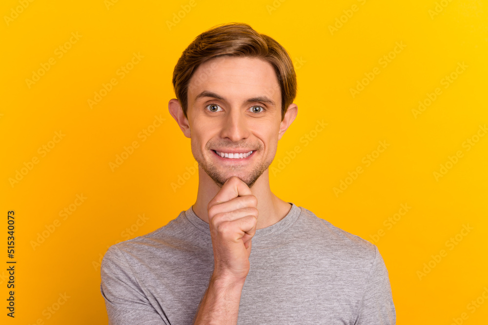 Photo of young handsome guy happy positive smile hand touch chin dream think isolated over pastel color background Photo of young handsome guy happy positive smile hand touch chin dream think isolated over pastel color background