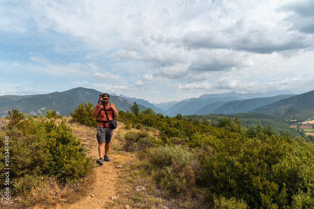 A man on a trek between the villages of Las Latas to Larrede near Sabiñanigo, Pyrenees aragon
