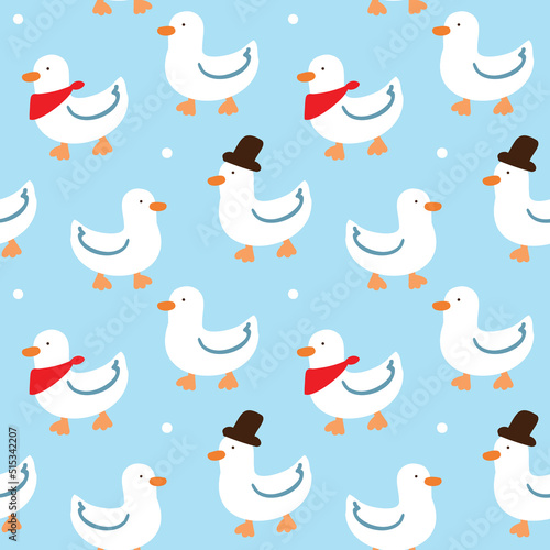 Seamless Pattern with Cartoon Duck Design on Blue Background © Supannee