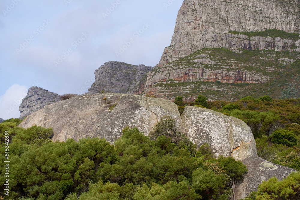 Landscape view of Lions Head in Cape Town, South Africa during a day. Beautiful mountains against a cloudy sky. Travelling and exploring mother nature through hiking adventures in summer