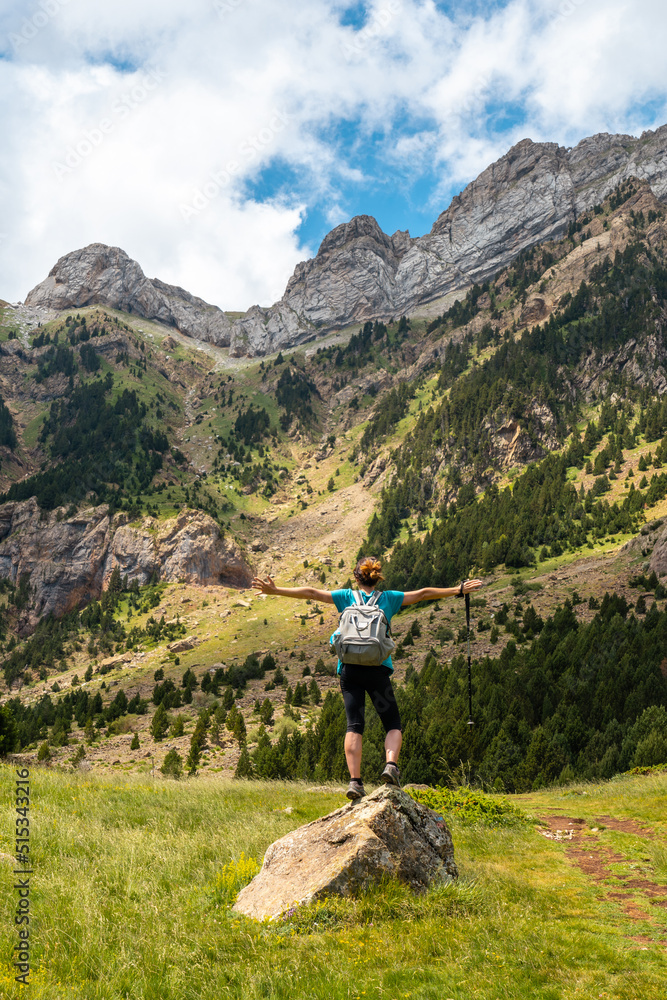 A hiker enjoying the mountain on vacation in the Pyrenees, Alto Gallego, Huesca, Aragon