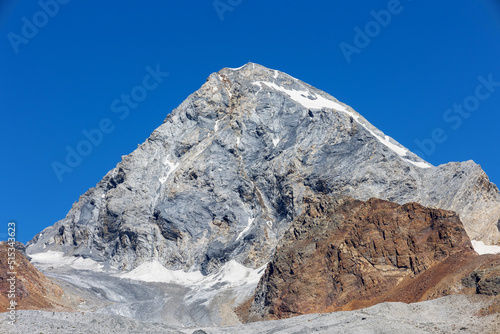 trekking on the slopes of Mount Gran Zebrù in the Stelvio National Park, Italy photo