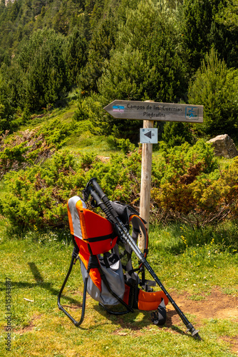 Backpack to transport children in trekking through nature in the Pyrenees, Huesca, Spain photo