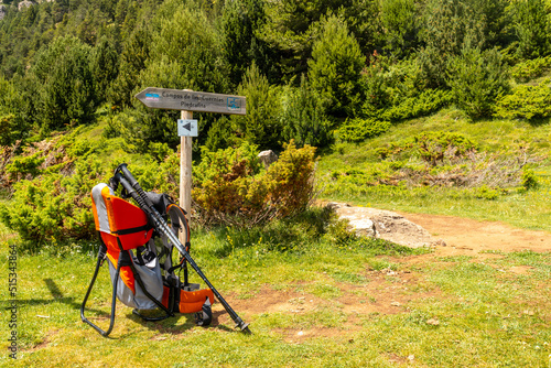 Backpack to transport children in trekking through nature in the Pyrenees, Huesca, Spain photo