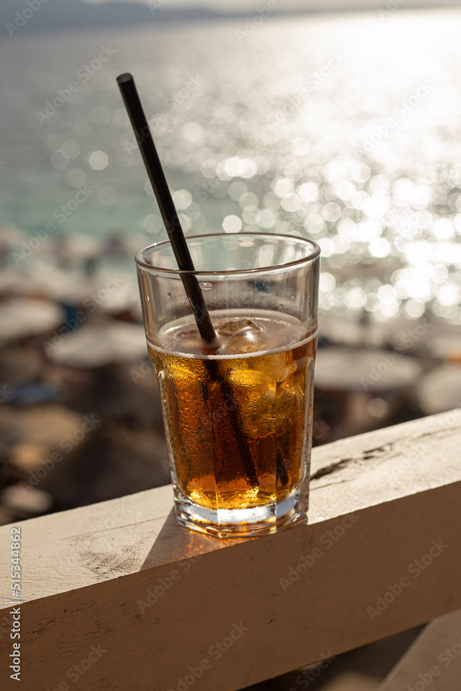 Refreshing summer cocktail at the bar on the beach. Summer party, summer vacations and travel concept. Refreshing summer cocktail at the bar on the beach. Summer party, summer vacations and travel concept.