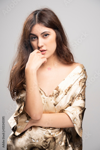 Portrait of beautiful young woman standing and looking at camera