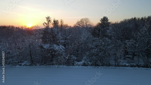 Snowy Windgarten Ennepetal Droneshot FlyOver Woods Towards Sunset photo