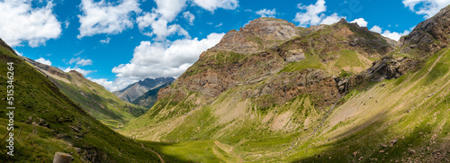 Panoramic view from the corner of the green and the Salto de Tendenera Waterfall in the Ripera Valley, Pyrenees