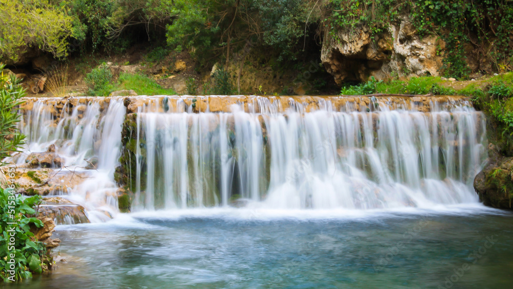 Fototapeta premium Flowing waterfall in Akchour, Chefchaouen, Morocco