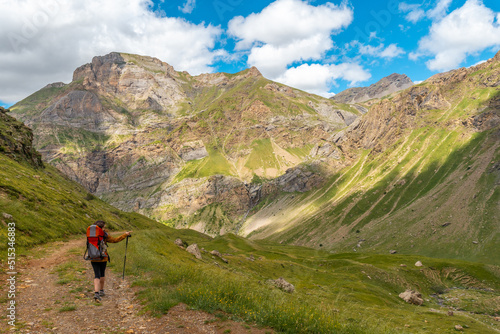 A young woman on the trail in the mountain trekking with her son in the Ripera valley, Pyrenees © unai