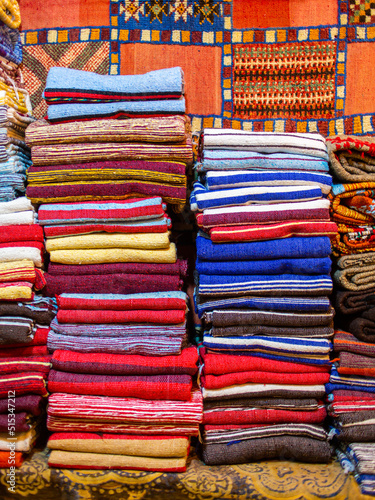 Chefchaouen, Morocco - 18 January 2022 : Colorful traditional silk and cotton fabrics in a Moroccan craft store