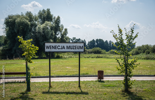 Sign indicating narrow gauge train station in Wenecja, Poland