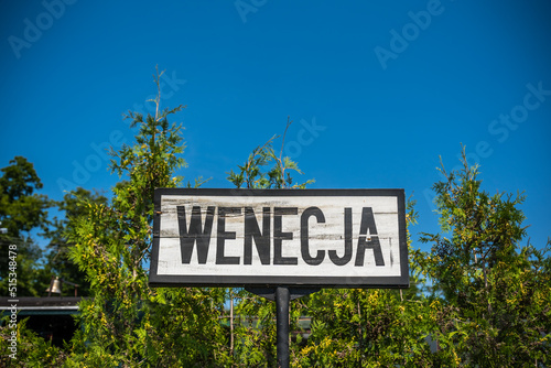Sign indicating narrow gauge train station in Wenecja, Poland