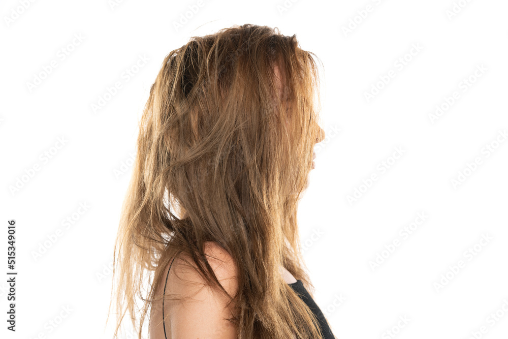 Profile of a young woman with messy long hair on a white background Profile of a young woman with messy long hair on a white background