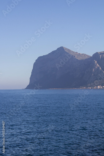 evocative image of sea coast with promontory on the background in Sicily, Italy © massimo